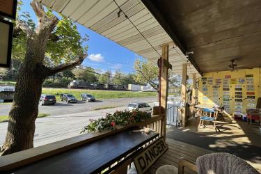 Our classic front porch is a popular place to sit back and watch the busy railroad roll by.